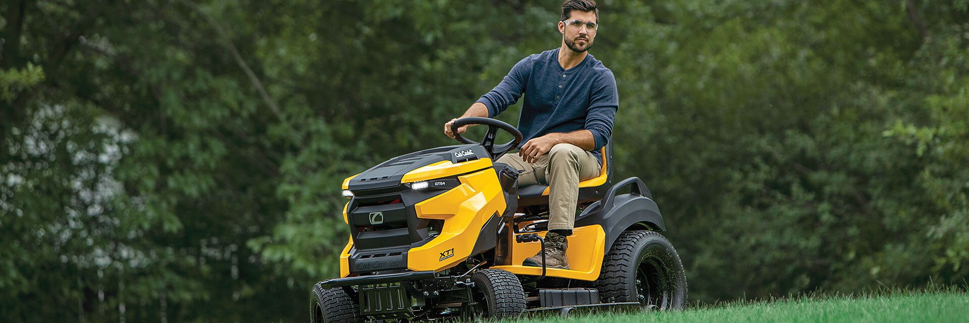 User on a riding mower outdoors