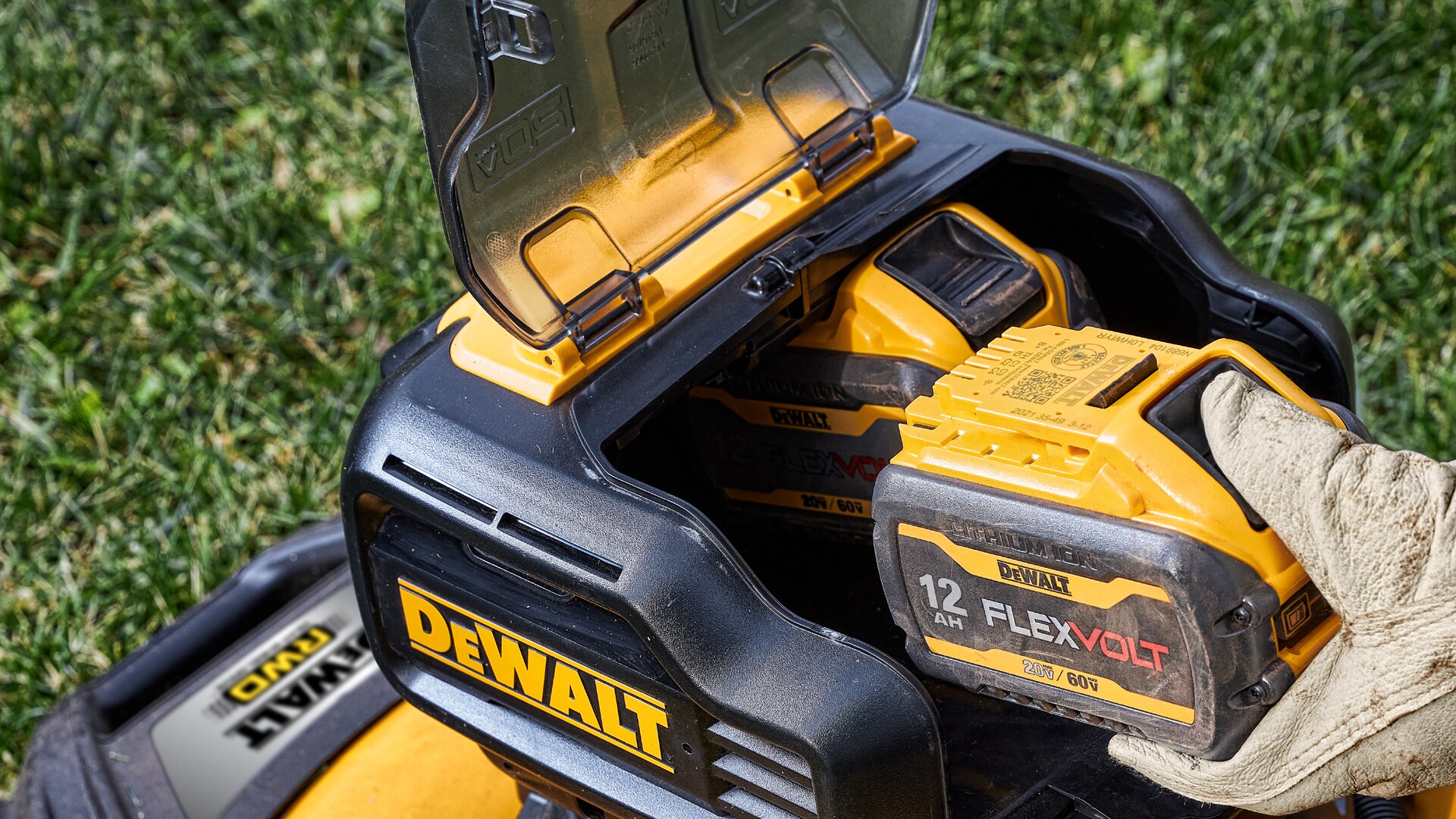 DeWalt Flexvolt Battery being inserted into mower