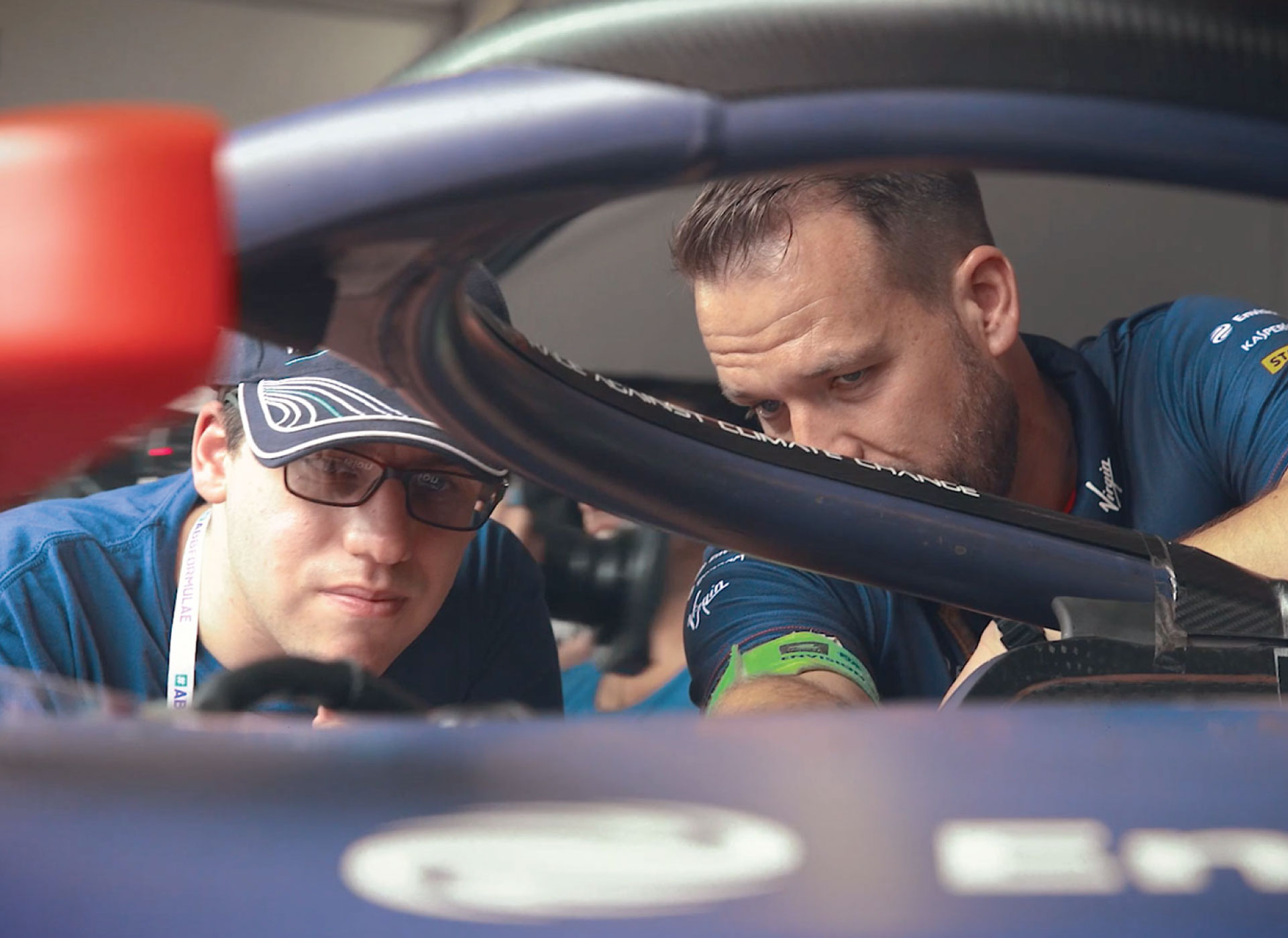 Two men inspecting an engine