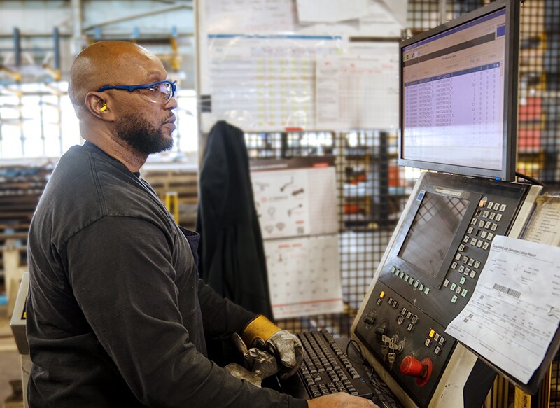 Stanley Black & Decker manufacturing employee wearing personal protective equipment in a plant