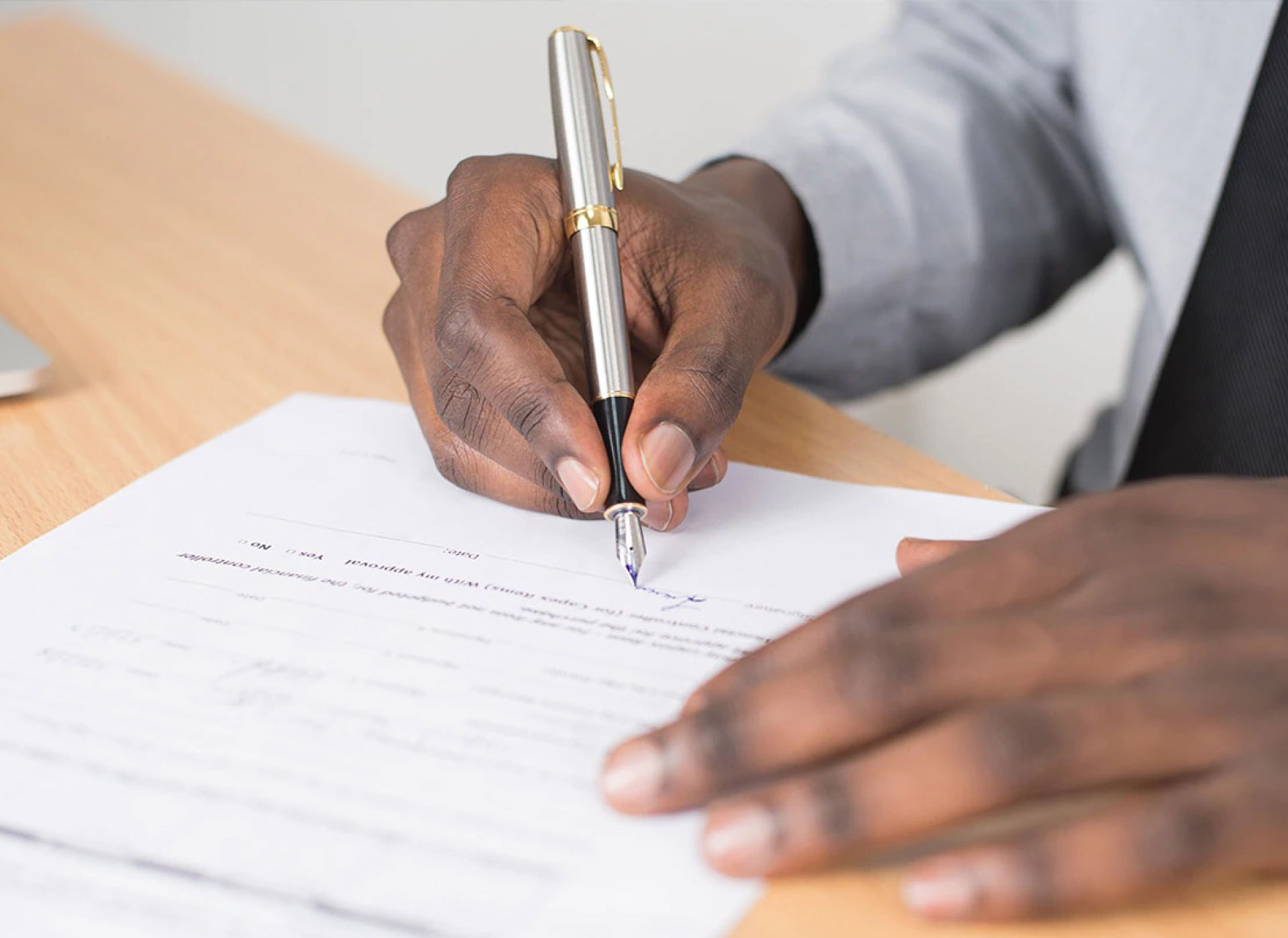 Man signing on a document