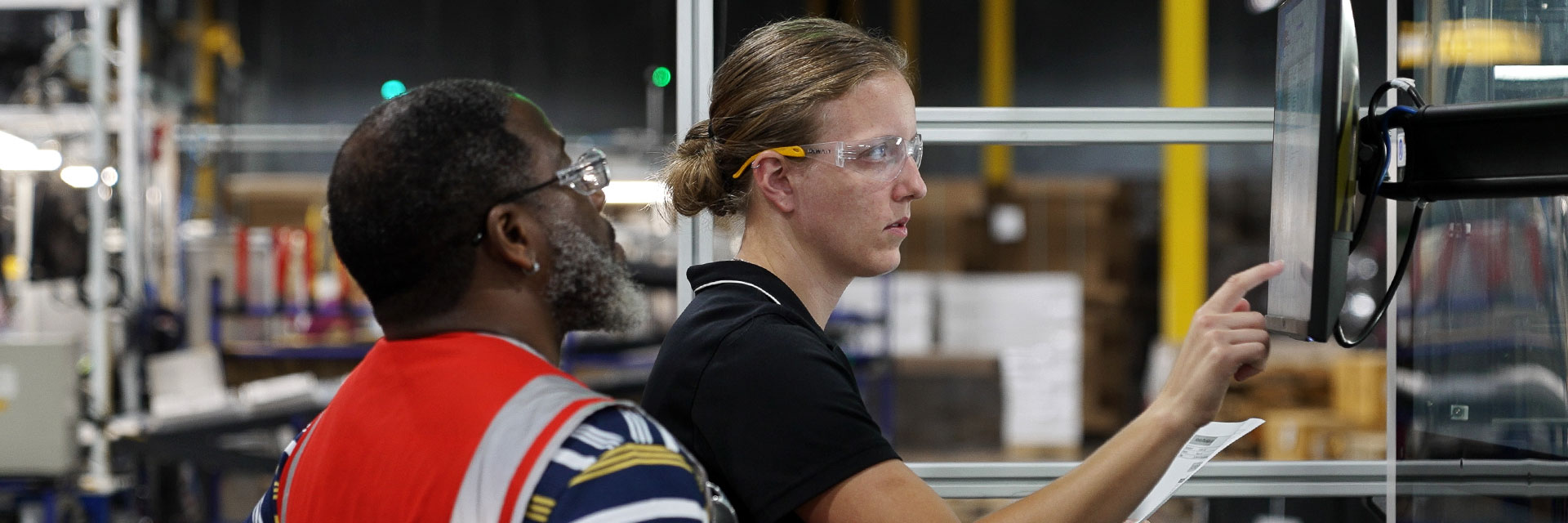 Two Stanley Black & Decker employees working together