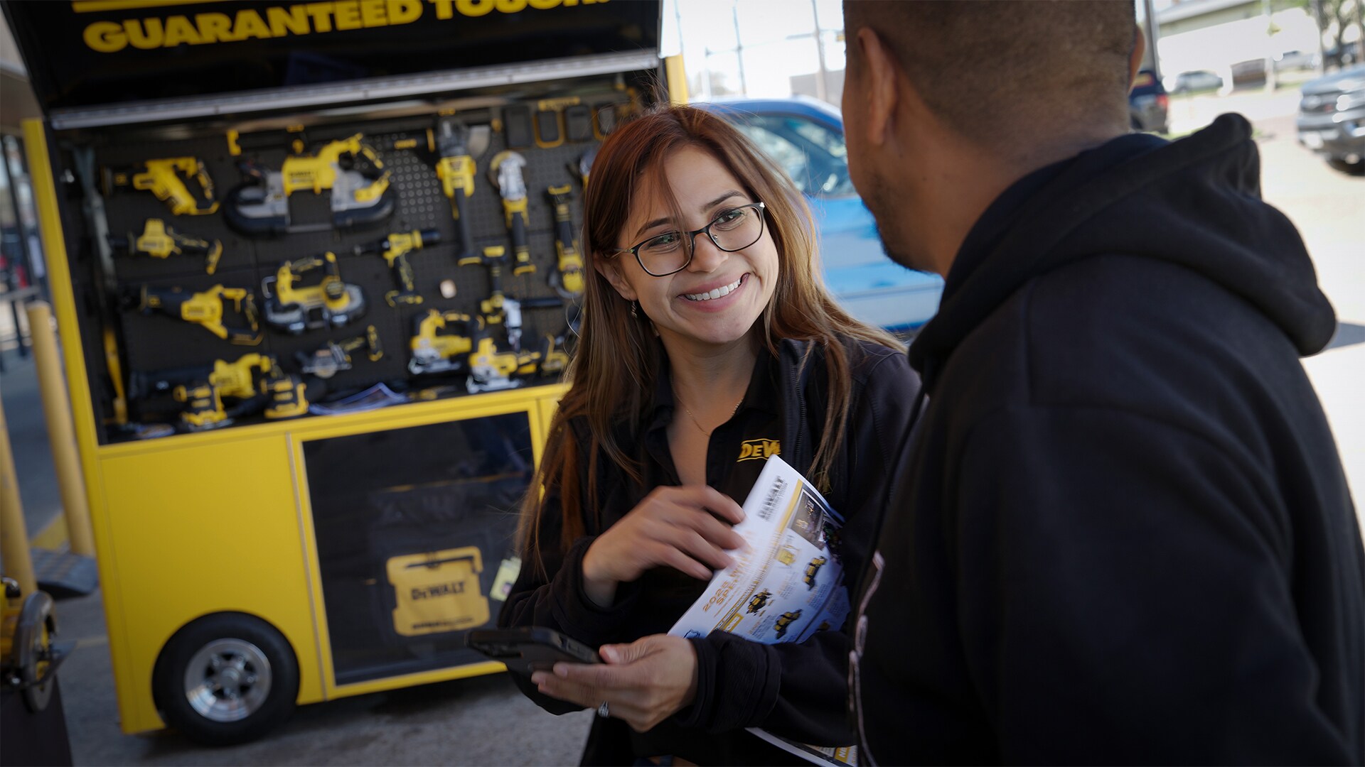 Stanley Black & Decker employee conversing with a customer