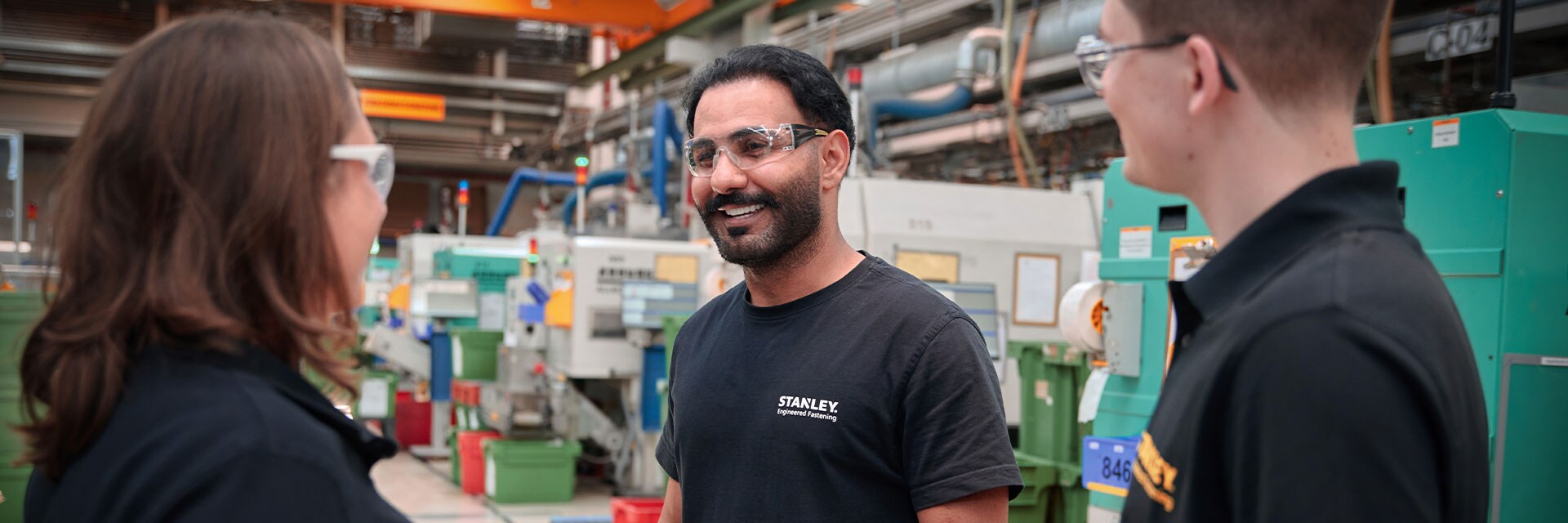 Stanley Black & Decker employees conversing in a facility